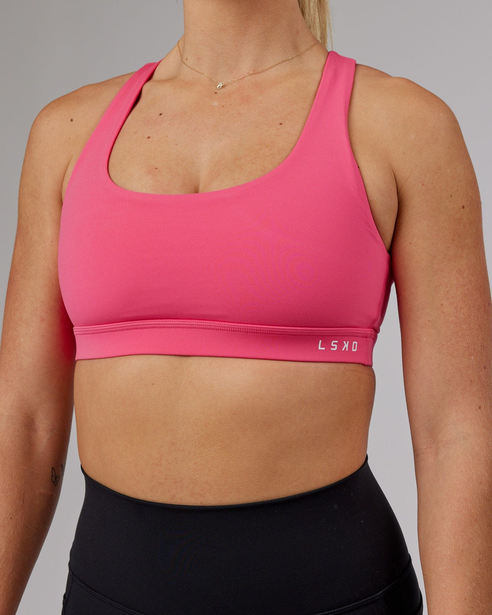 Model wearing Base Sports Bra - Flamingo