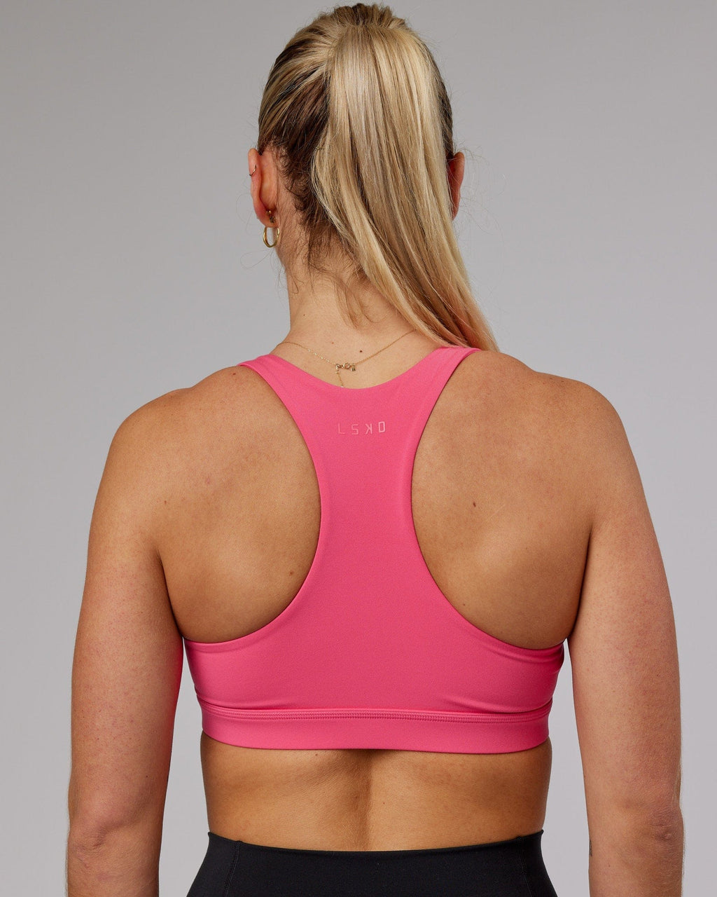 Model wearing Base Sports Bra - Flamingo