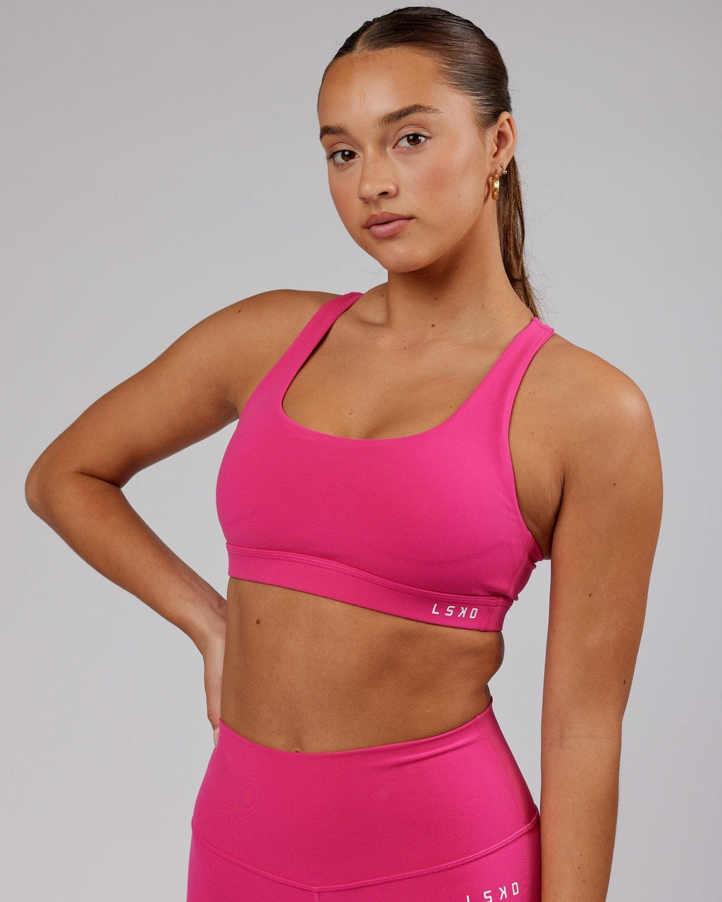 Model wearing Base Sports Bra - Magenta