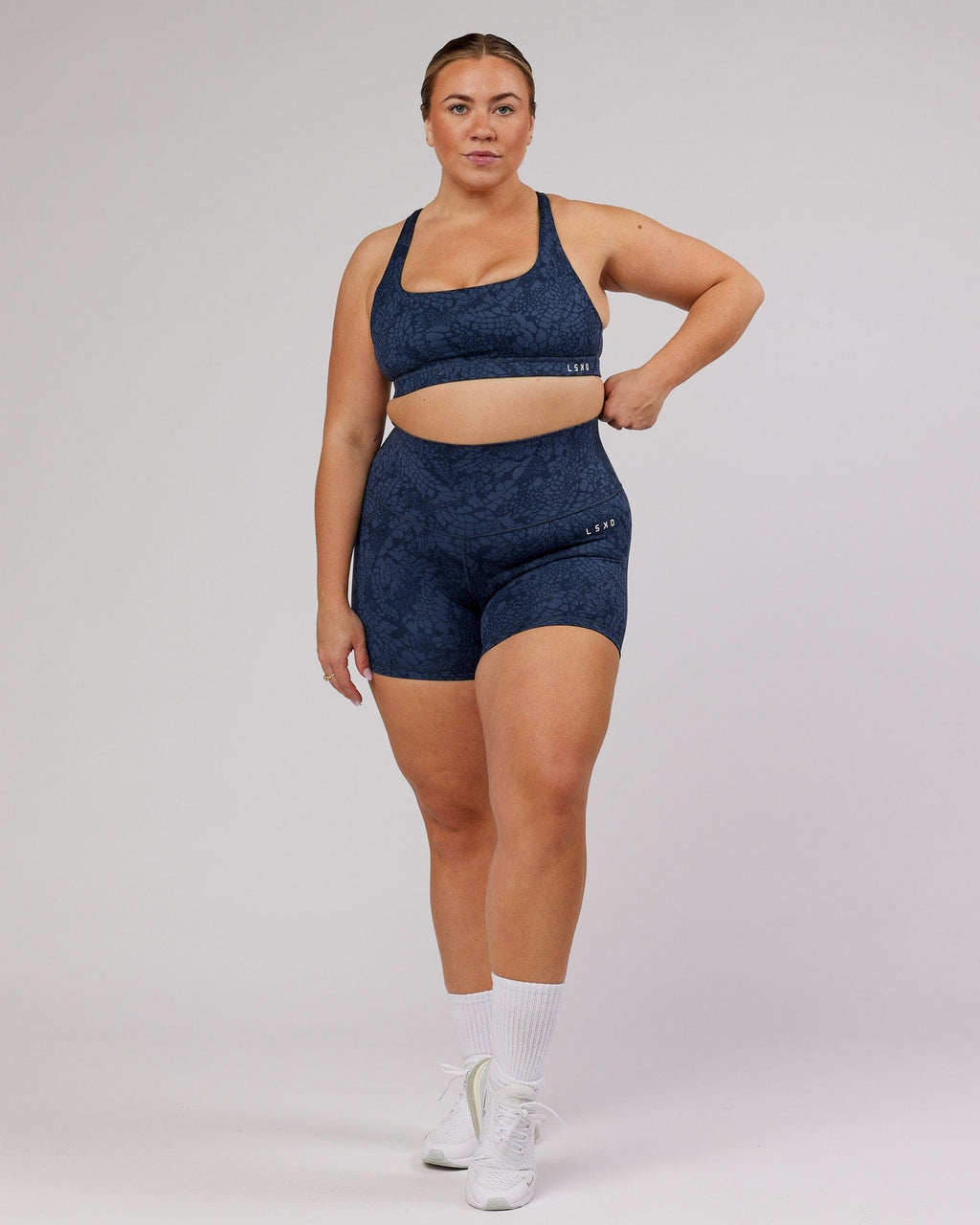Model wearing Base Sports Bra - Navy Mamba