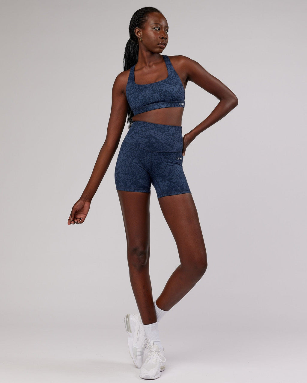 Model wearing Base Sports Bra - Navy Mamba