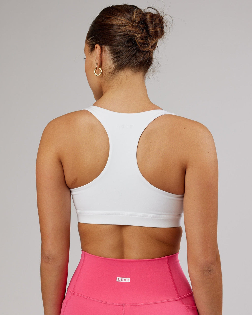 Model wearing Base Sports Bra - White-Flamingo
