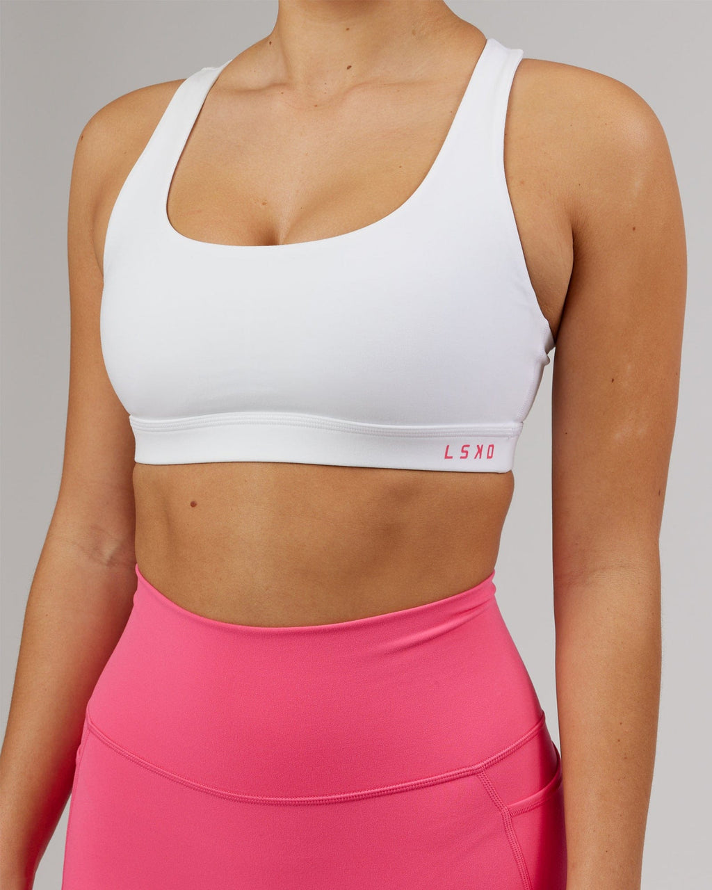 Model wearing Base Sports Bra - White-Flamingo