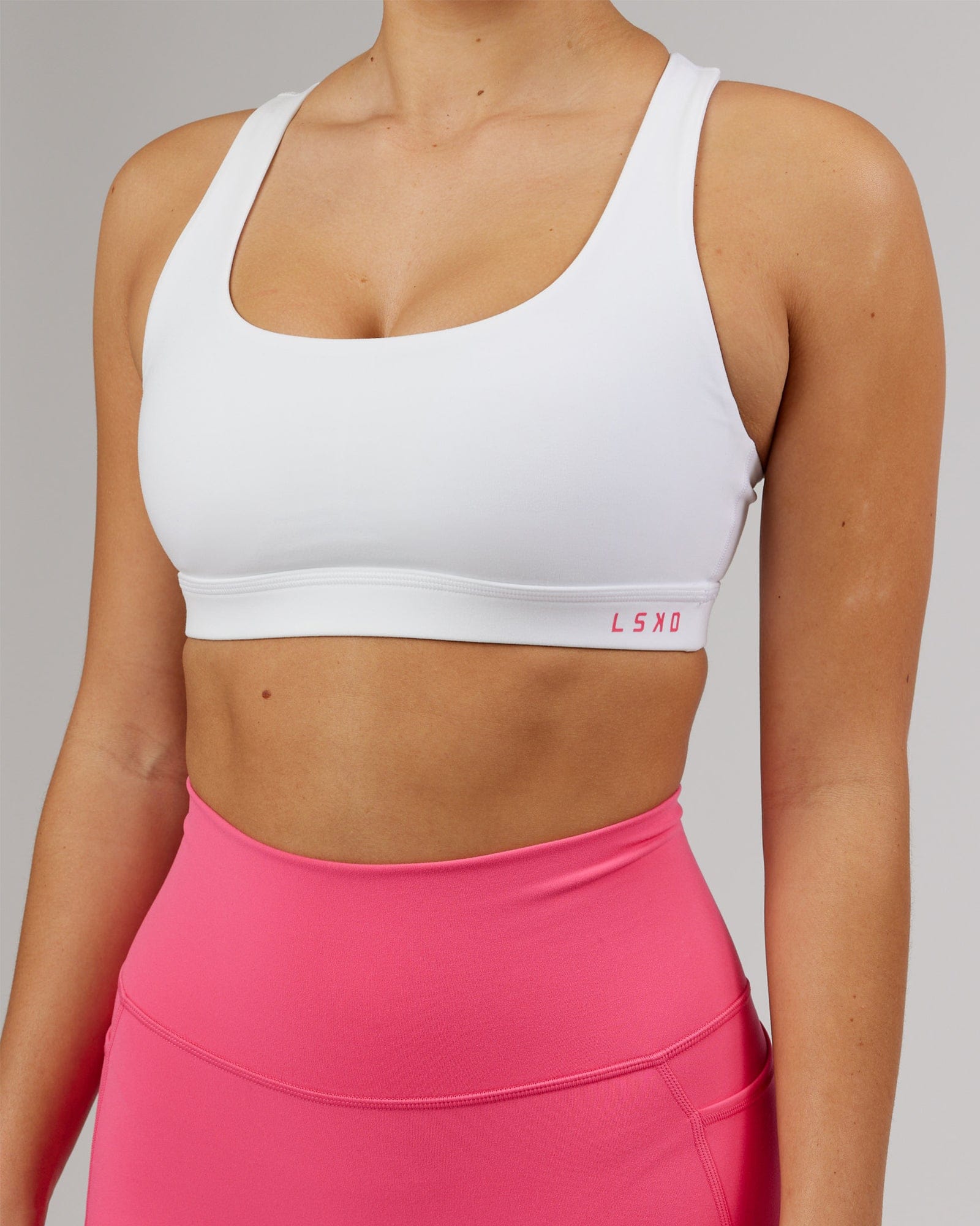 Model wearing Base Sports Bra - White-Flamingo