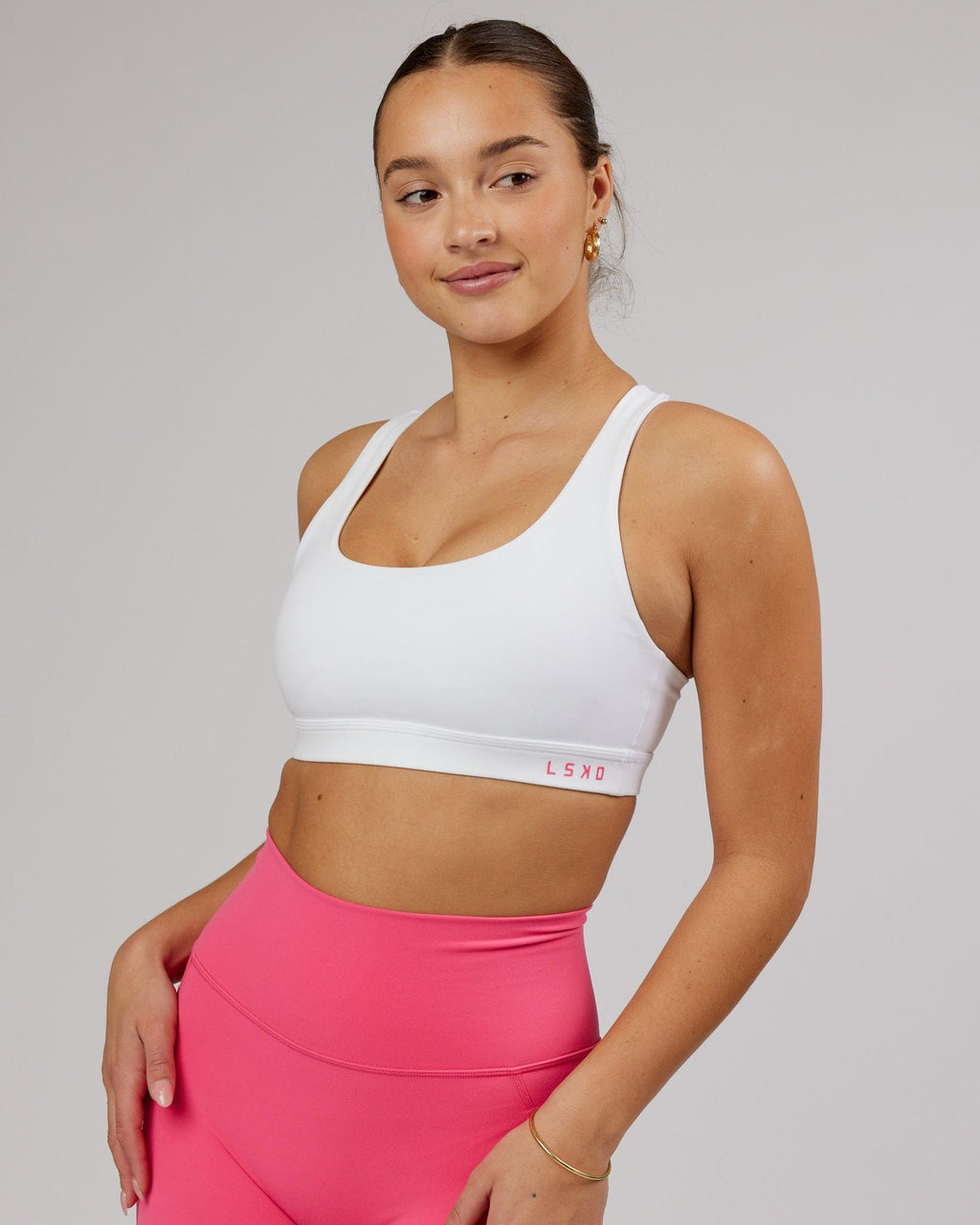 Model wearing Base Sports Bra - White-Flamingo