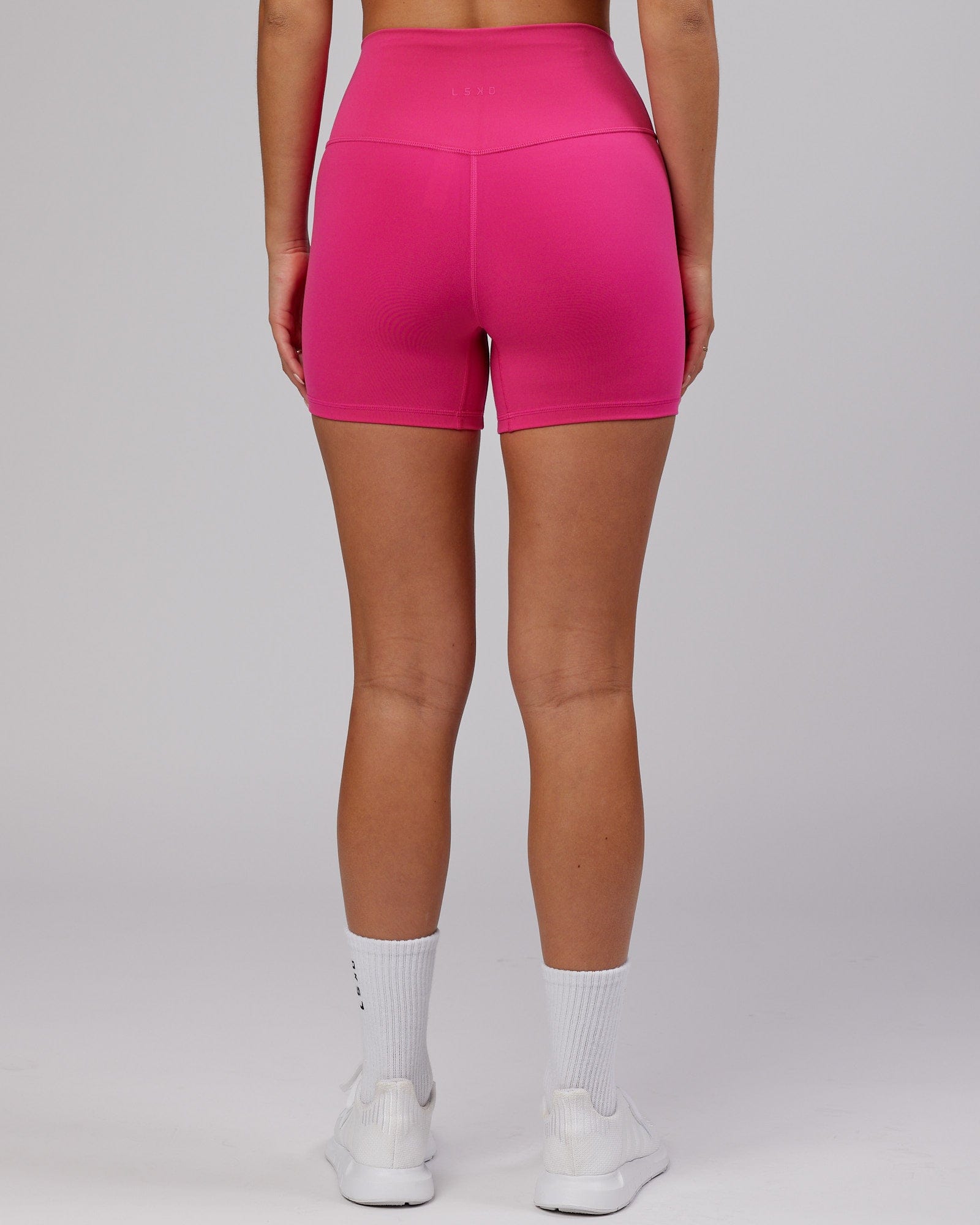 Model wearing Base X-Short Tight - Magenta
