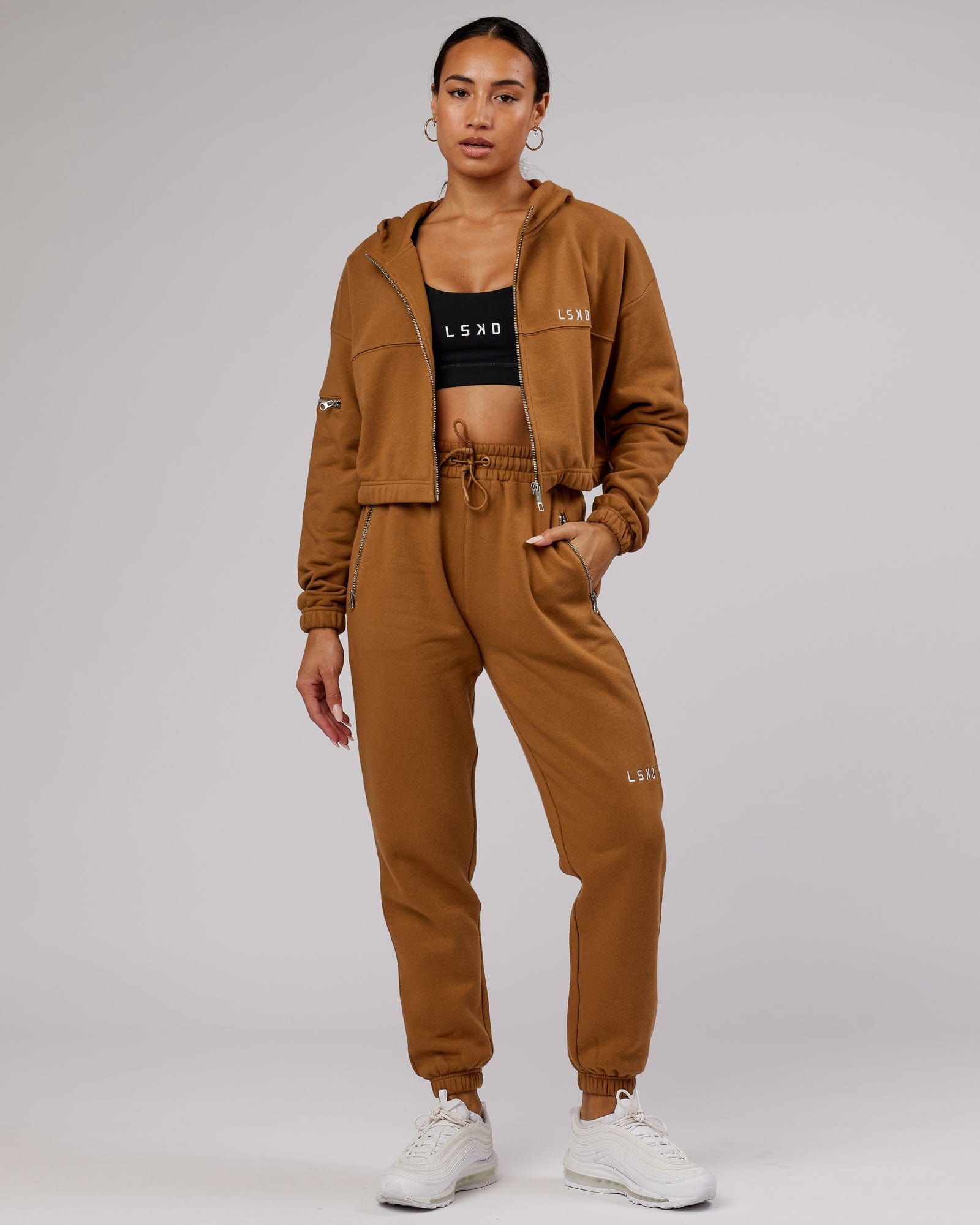 Model wearing Becca Track Pant - Camel