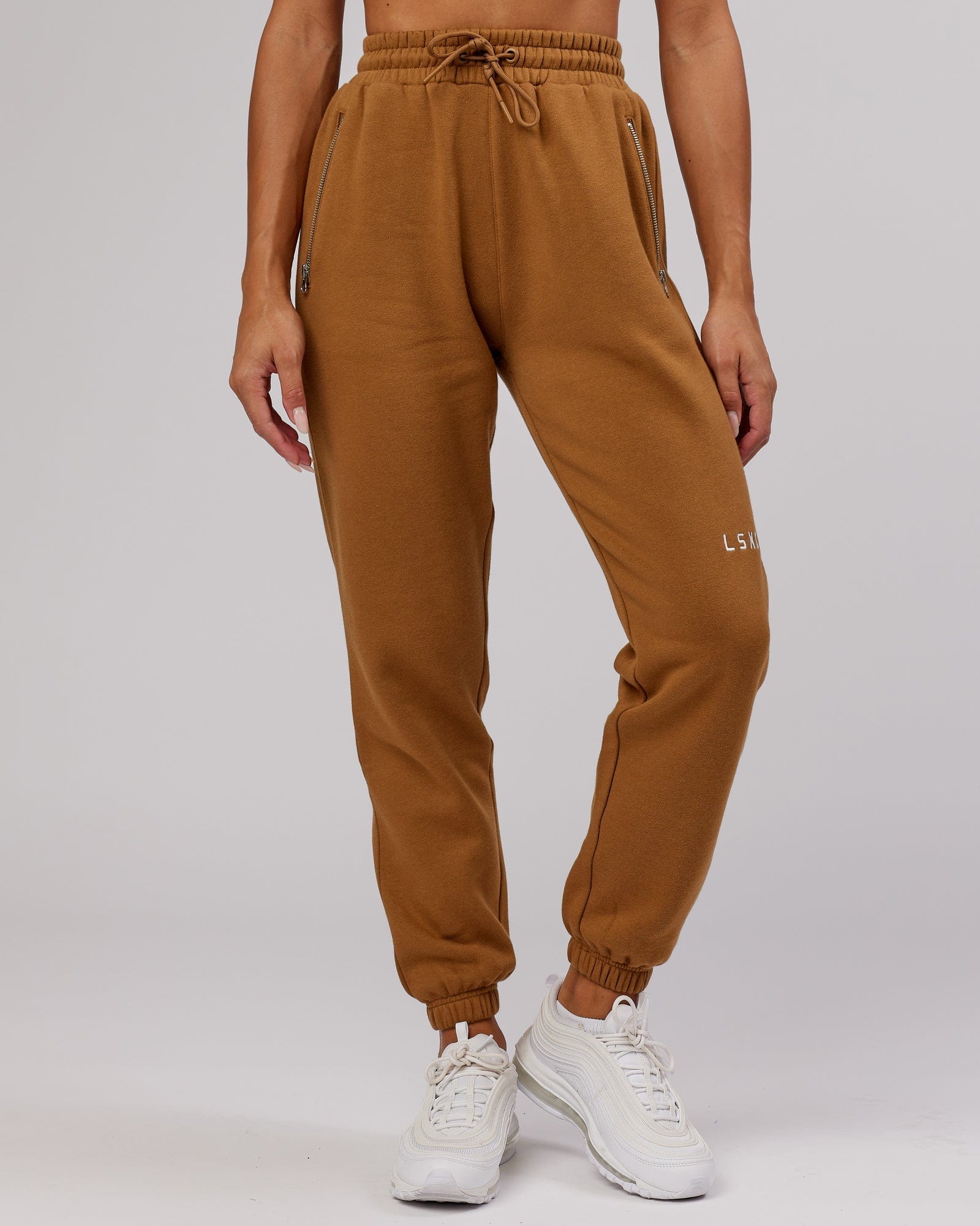 Model wearing Becca Track Pant - Camel