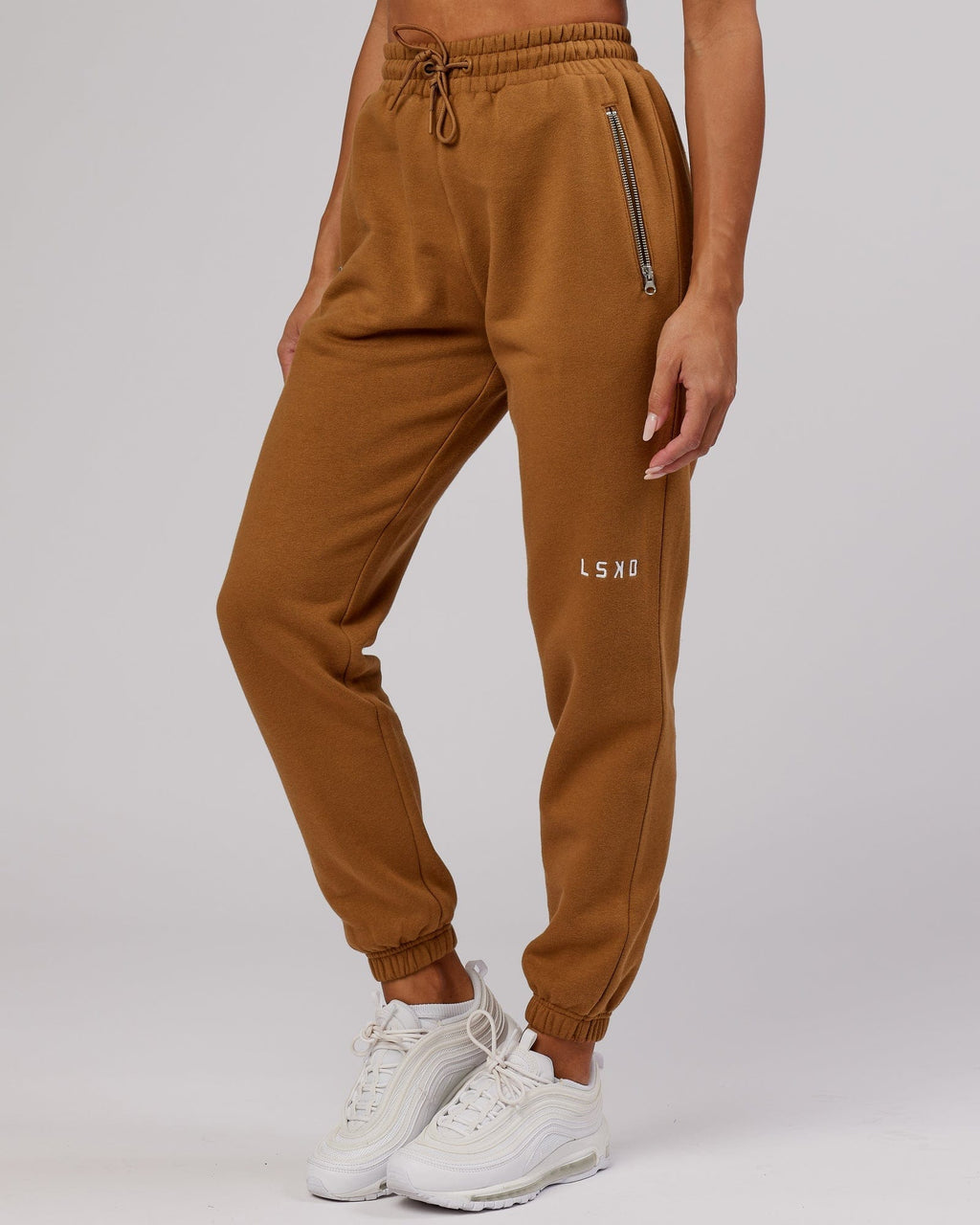 Model wearing Becca Track Pant - Camel