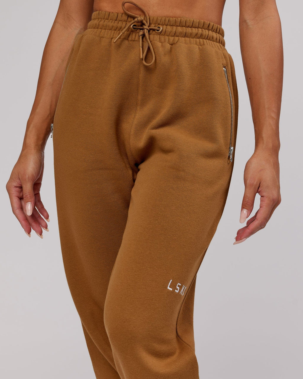 Model wearing Becca Track Pant - Camel