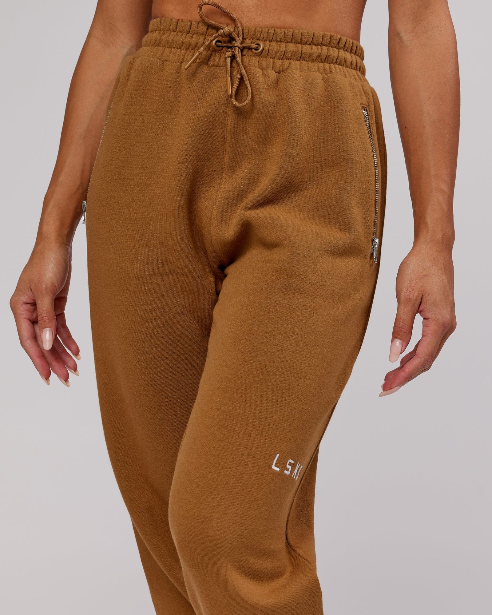 Model wearing Becca Track Pant - Camel