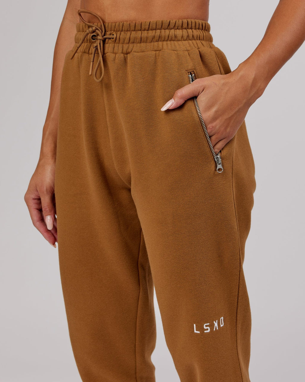 Model wearing Becca Track Pant - Camel