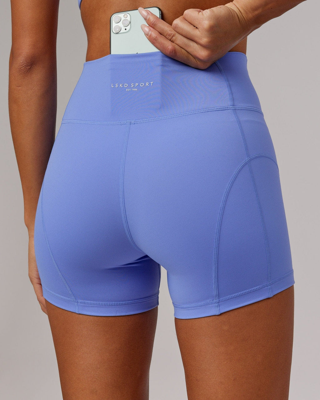 Model wearing Bend X-Short Tight - Indulgent Blue