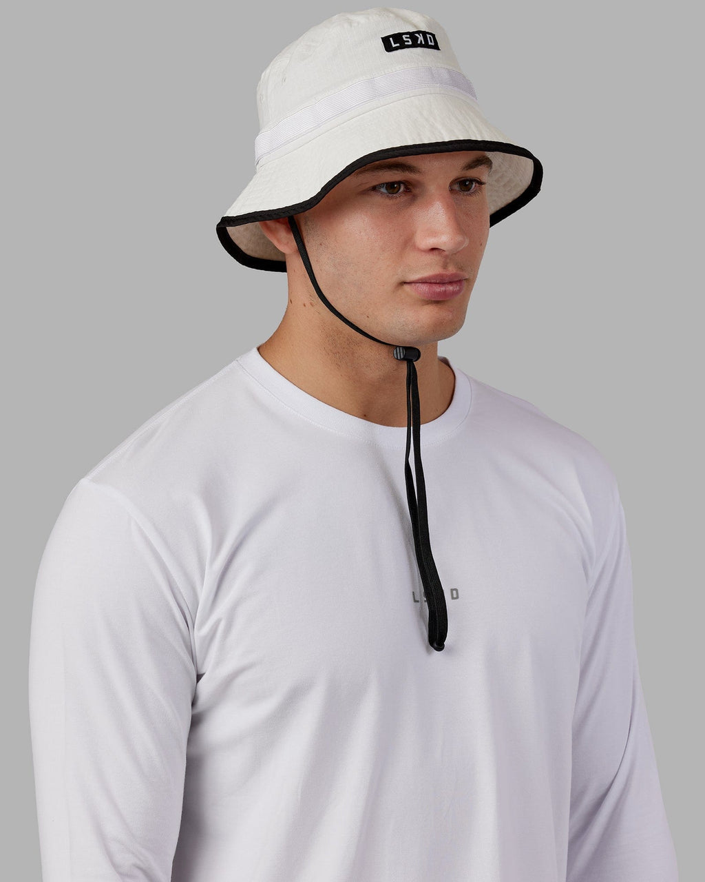 Model wearing Performance Boonie Hat - White