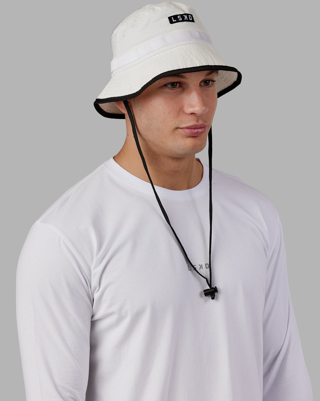 Model wearing Performance Boonie Hat - White