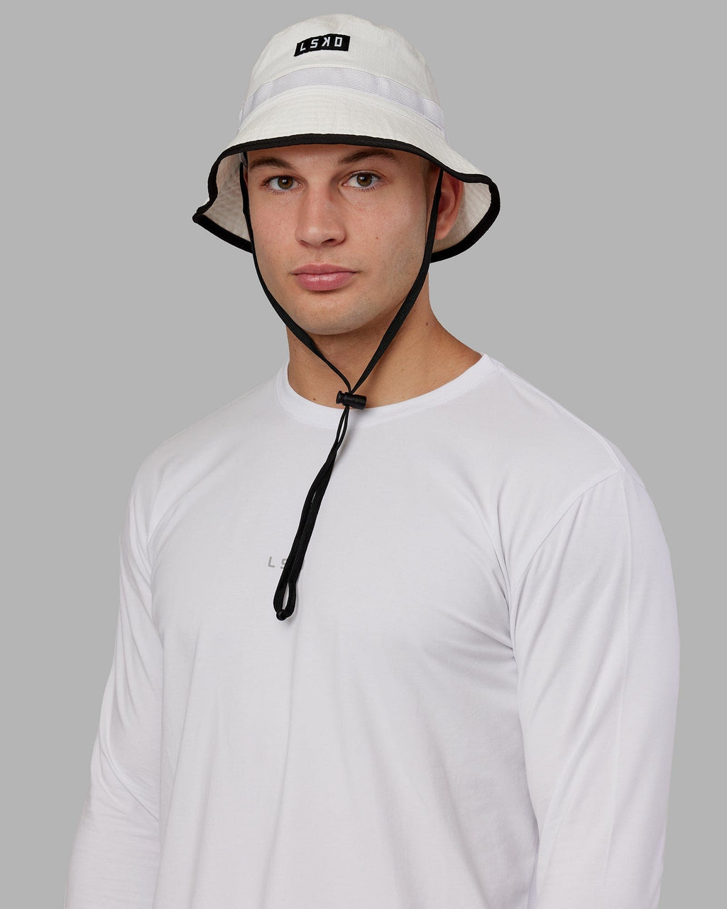 Model wearing Performance Boonie Hat - White
