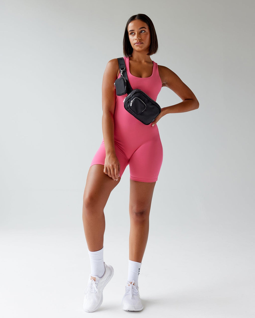 Model wearing Boost Bodysuit - Flamingo