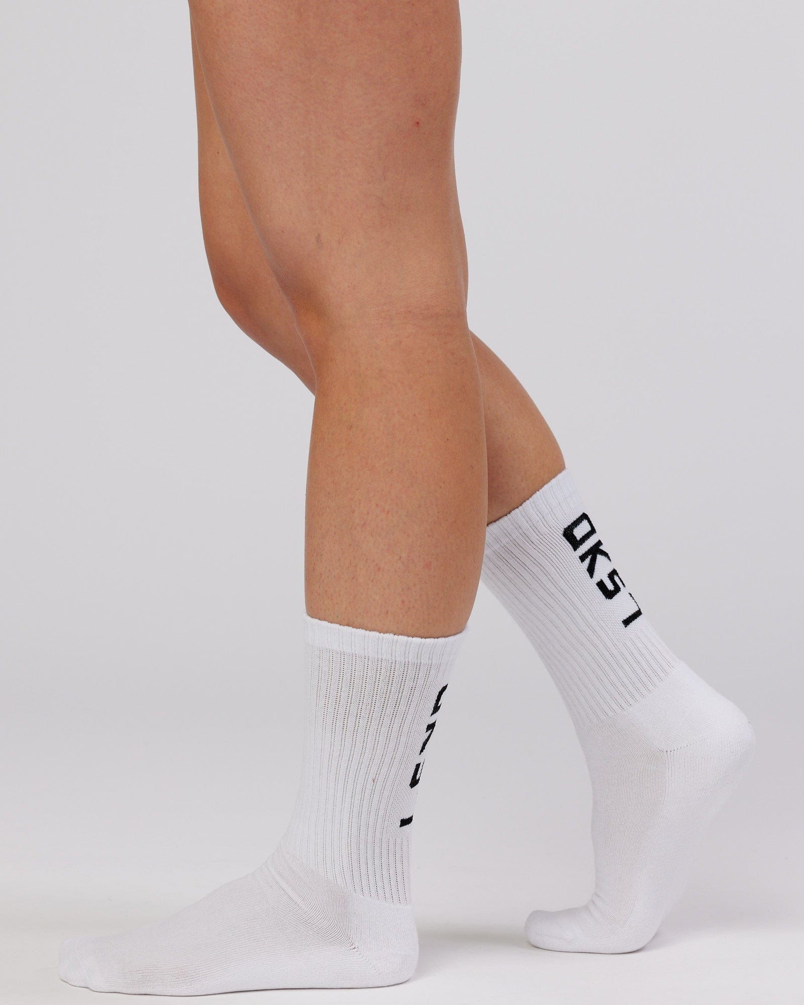 Model wearing Brand Crew Sock - White