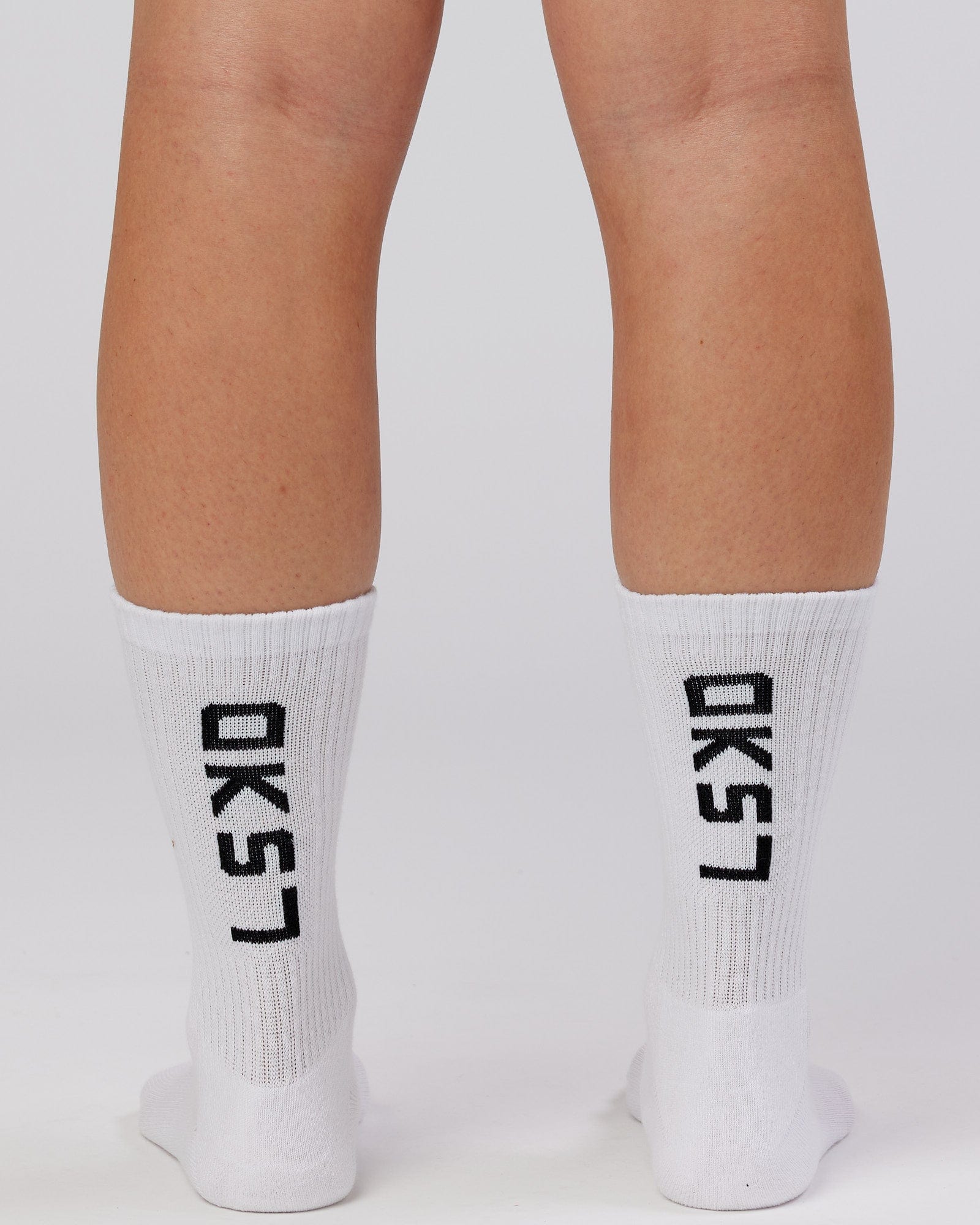 Model wearing Brand Crew Sock - White