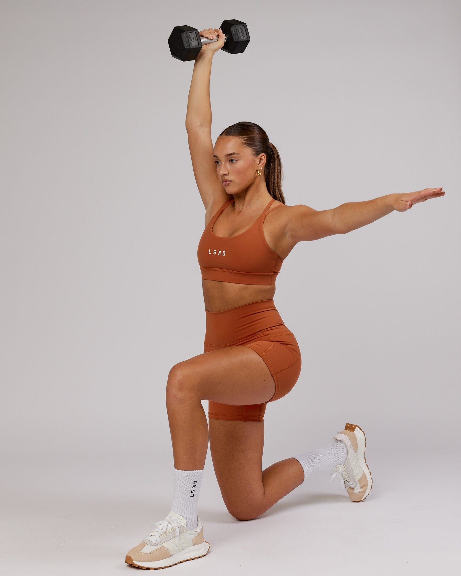 Model wearing Bridge Sports Bra - Auburn