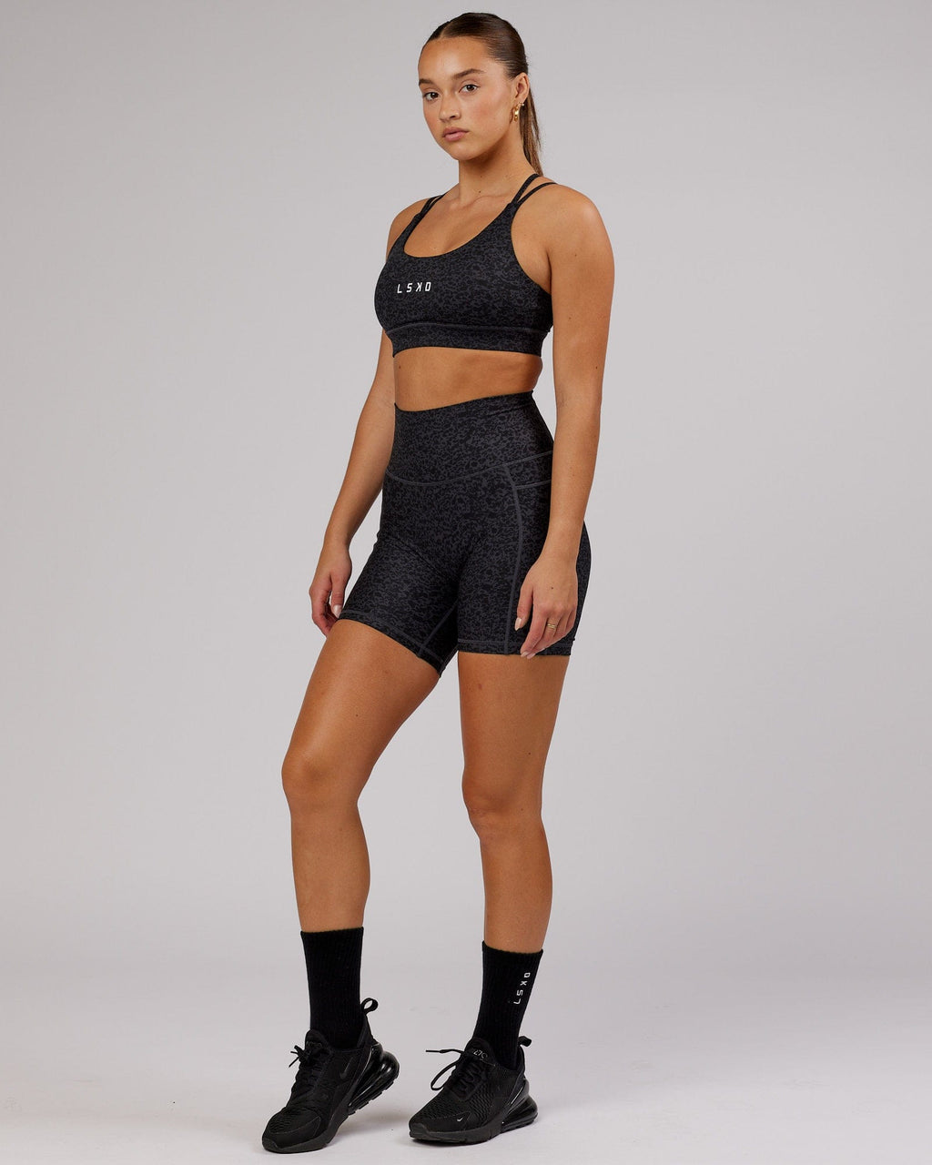 Model wearing Bridge Sports Bra - Black Etching