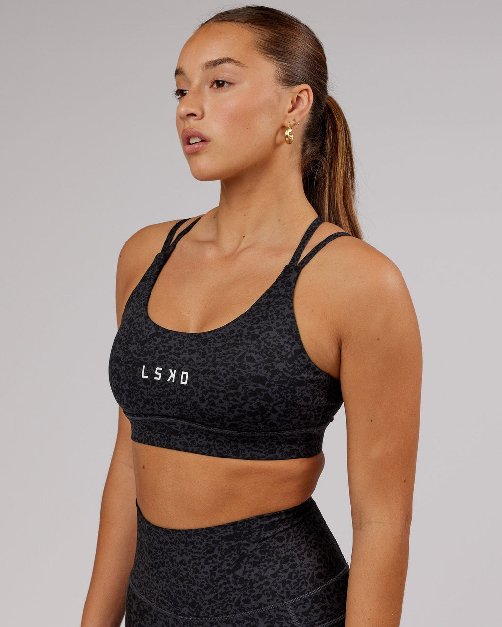 Model wearing Bridge Sports Bra - Black Etching