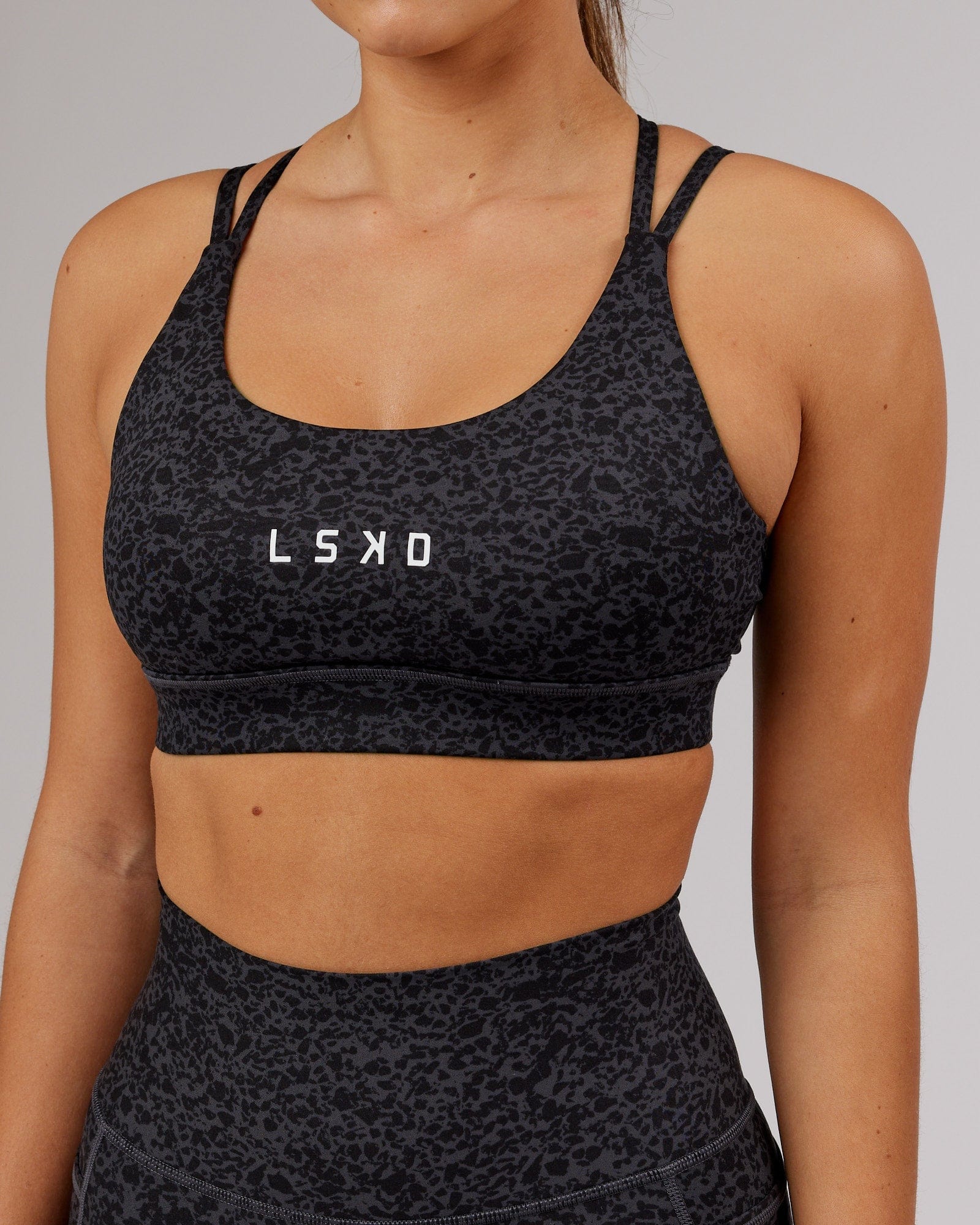 Model wearing Bridge Sports Bra - Black Etching