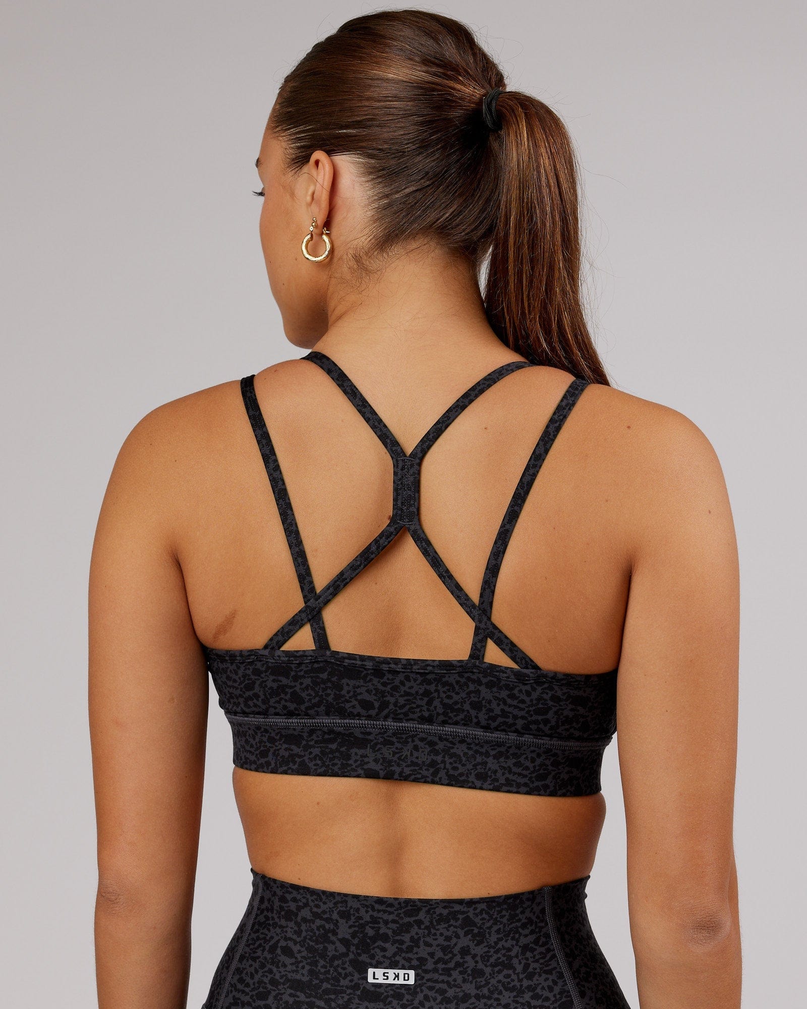 Model wearing Bridge Sports Bra - Black Etching