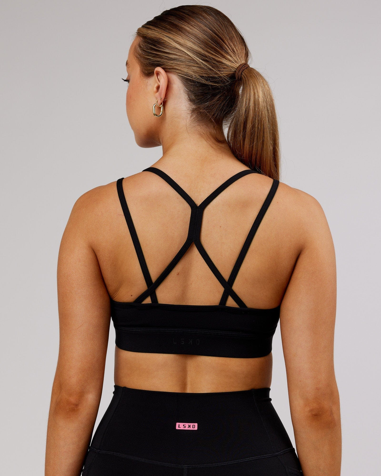 Model wearing Bridge Sports Bra - Black-White