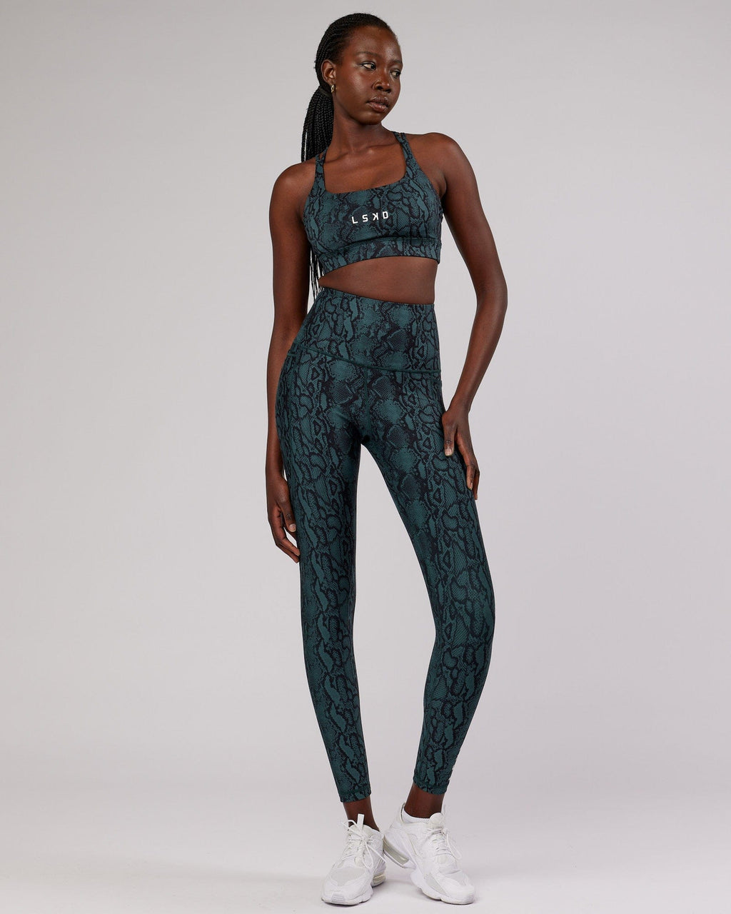 Model wearing Bridge Sports Bra - Forest Snakeskin