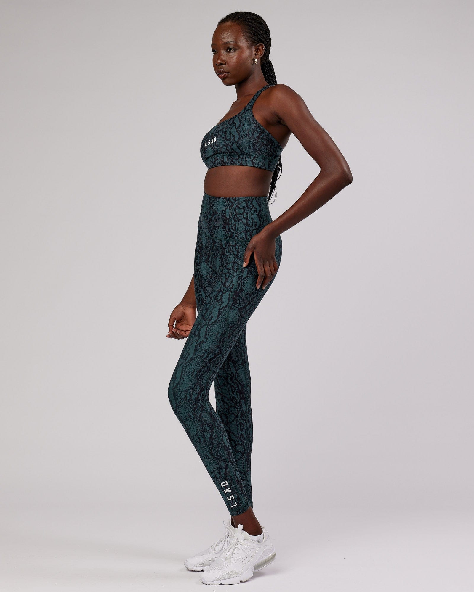 Model wearing Bridge Sports Bra - Forest Snakeskin