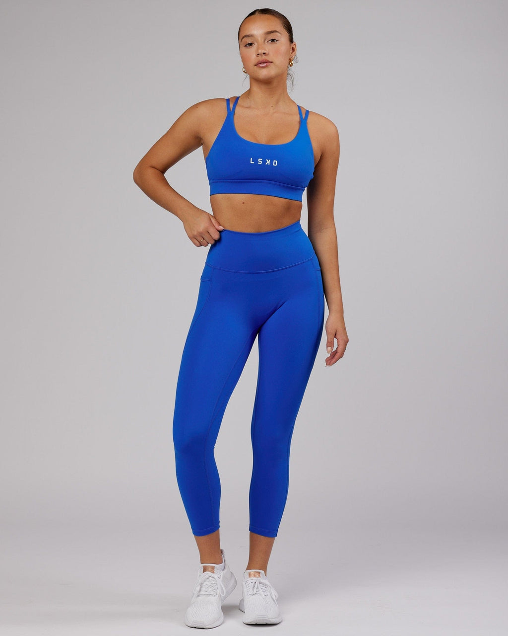 Model wearing Bridge Sports Bra - Strong Blue