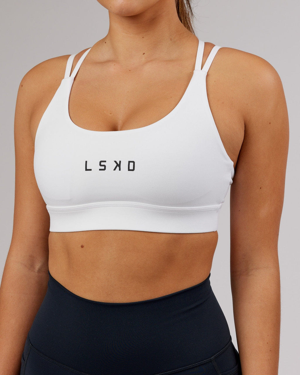 Model wearing Bridge Sports Bra - White