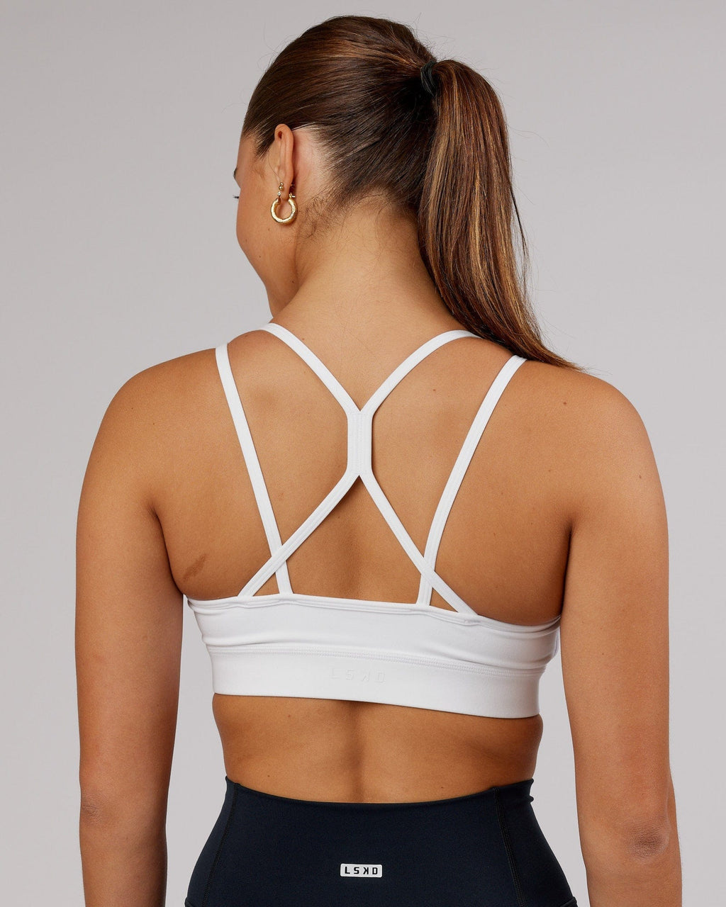 Model wearing Bridge Sports Bra - White