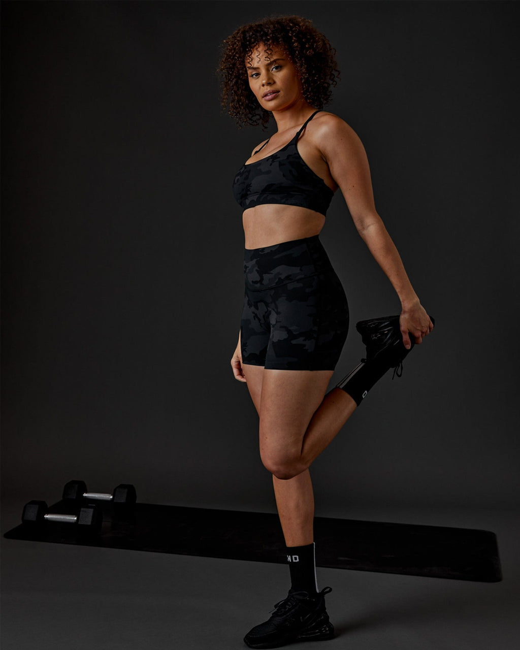 Model wearing Elixir X-Short Tight - Black Camo