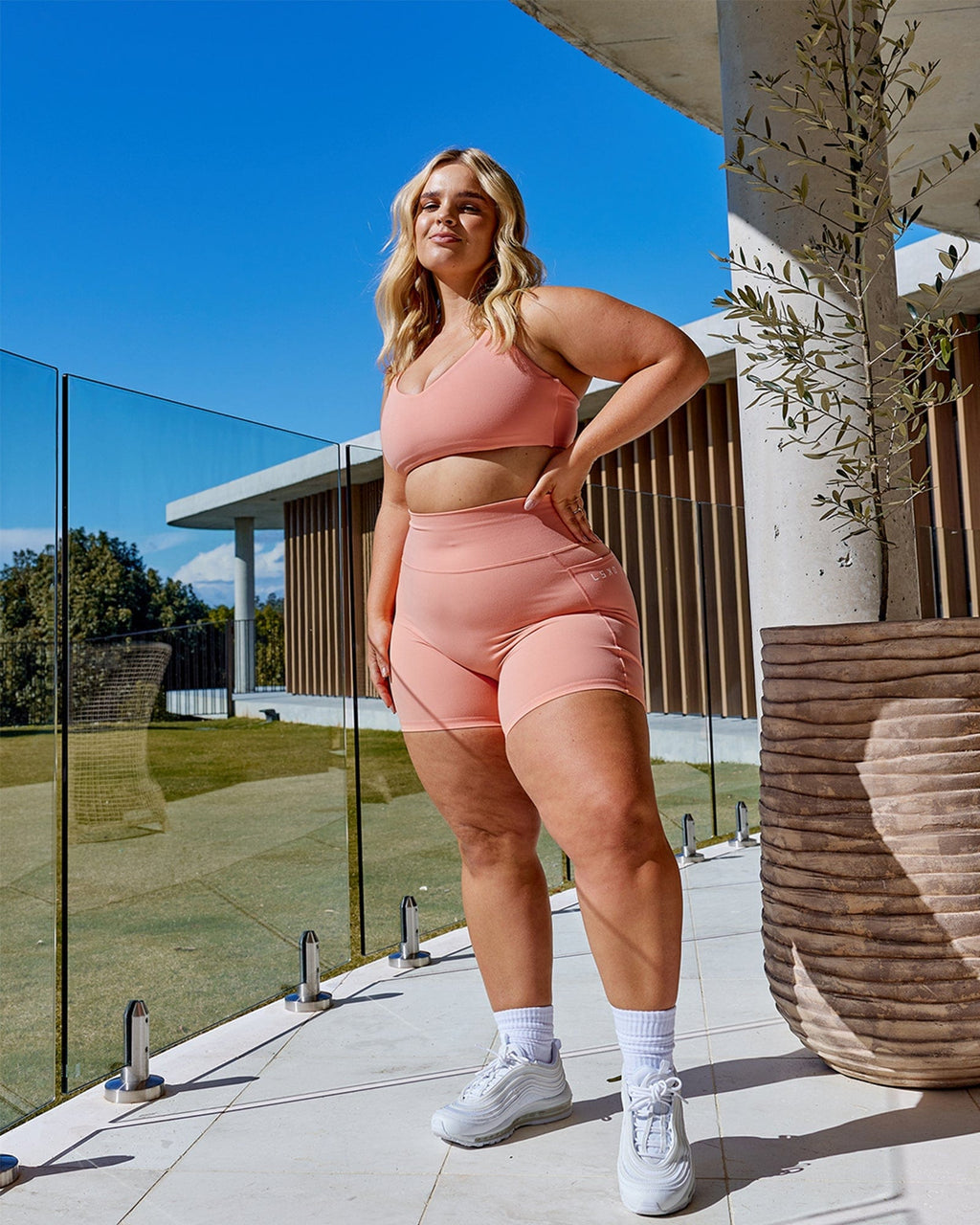 Model wearing Uplift Sports Bra - Peach