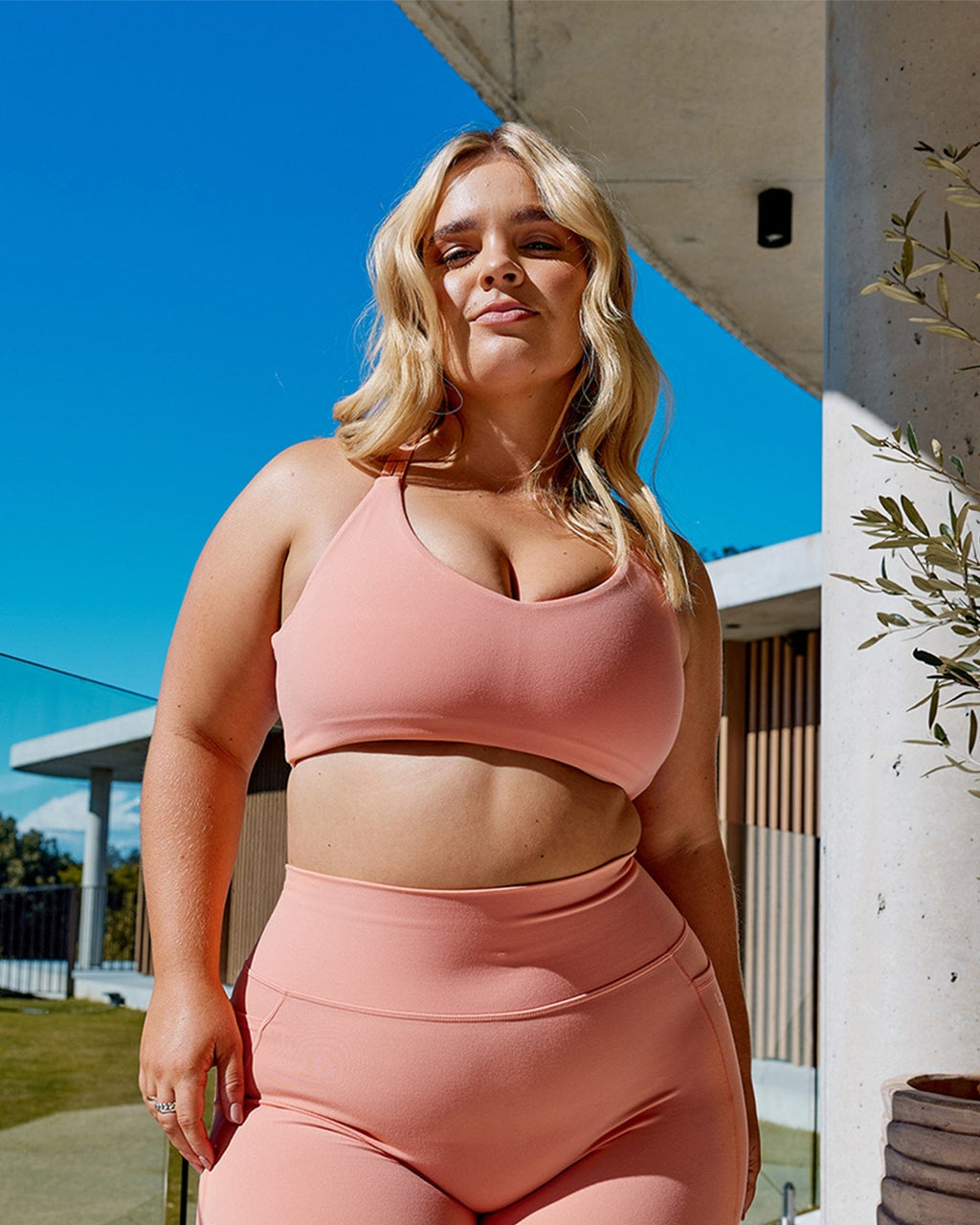 Model wearing Uplift Sports Bra - Peach