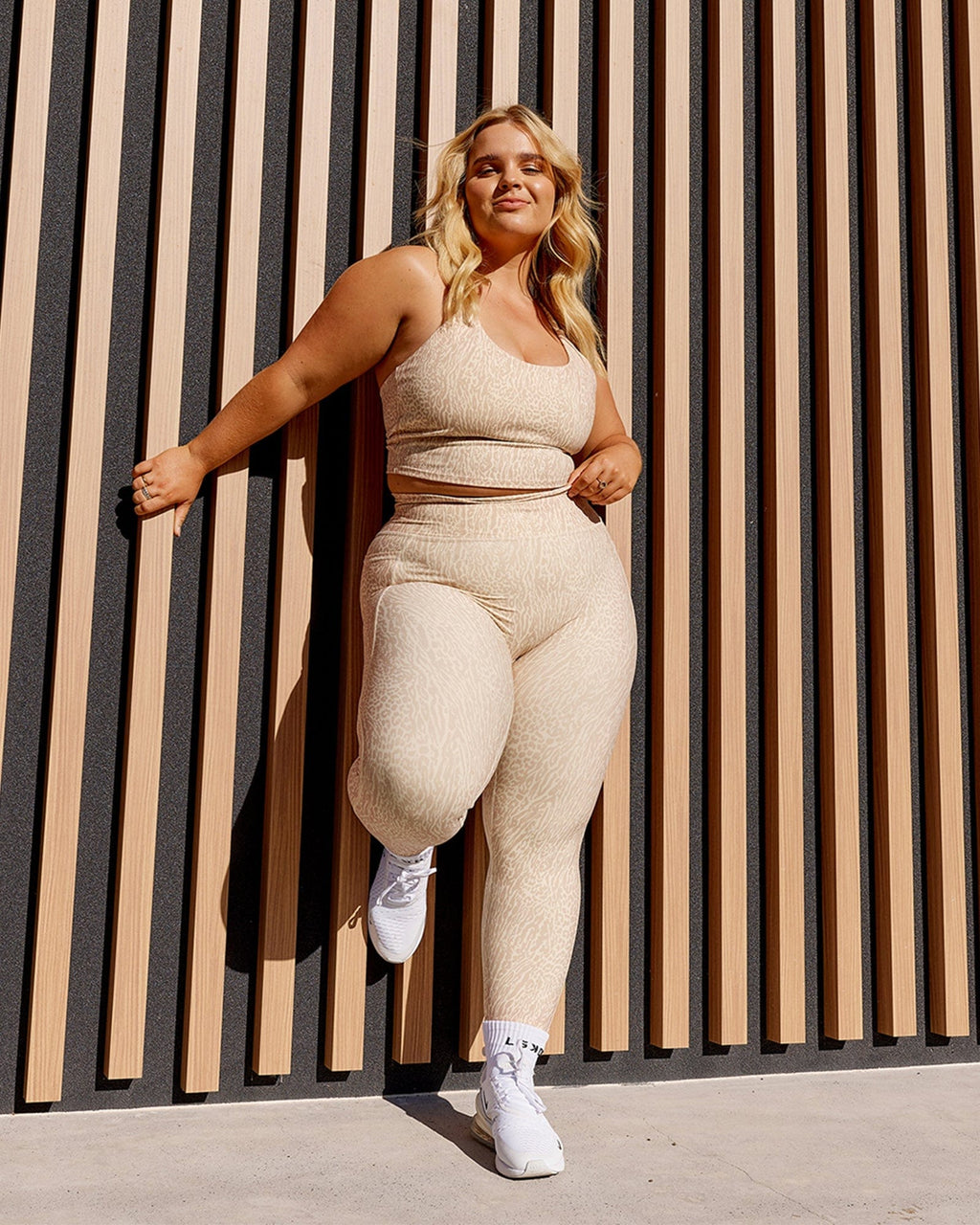 Model wearing Determined Shelf Sports Tank - Rise Print