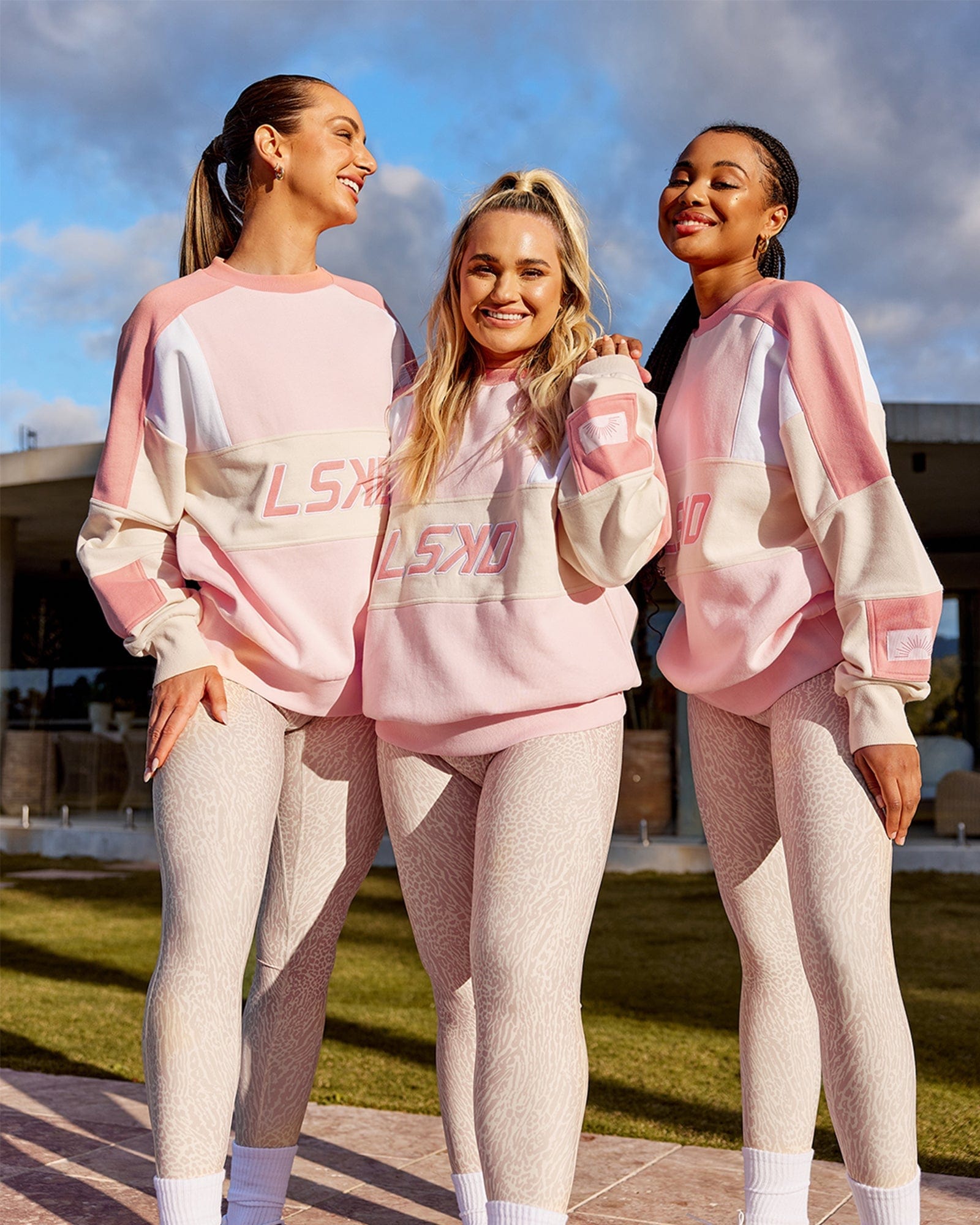 Model wearing Unisex Slam Oversize Sweater - Peach Multi