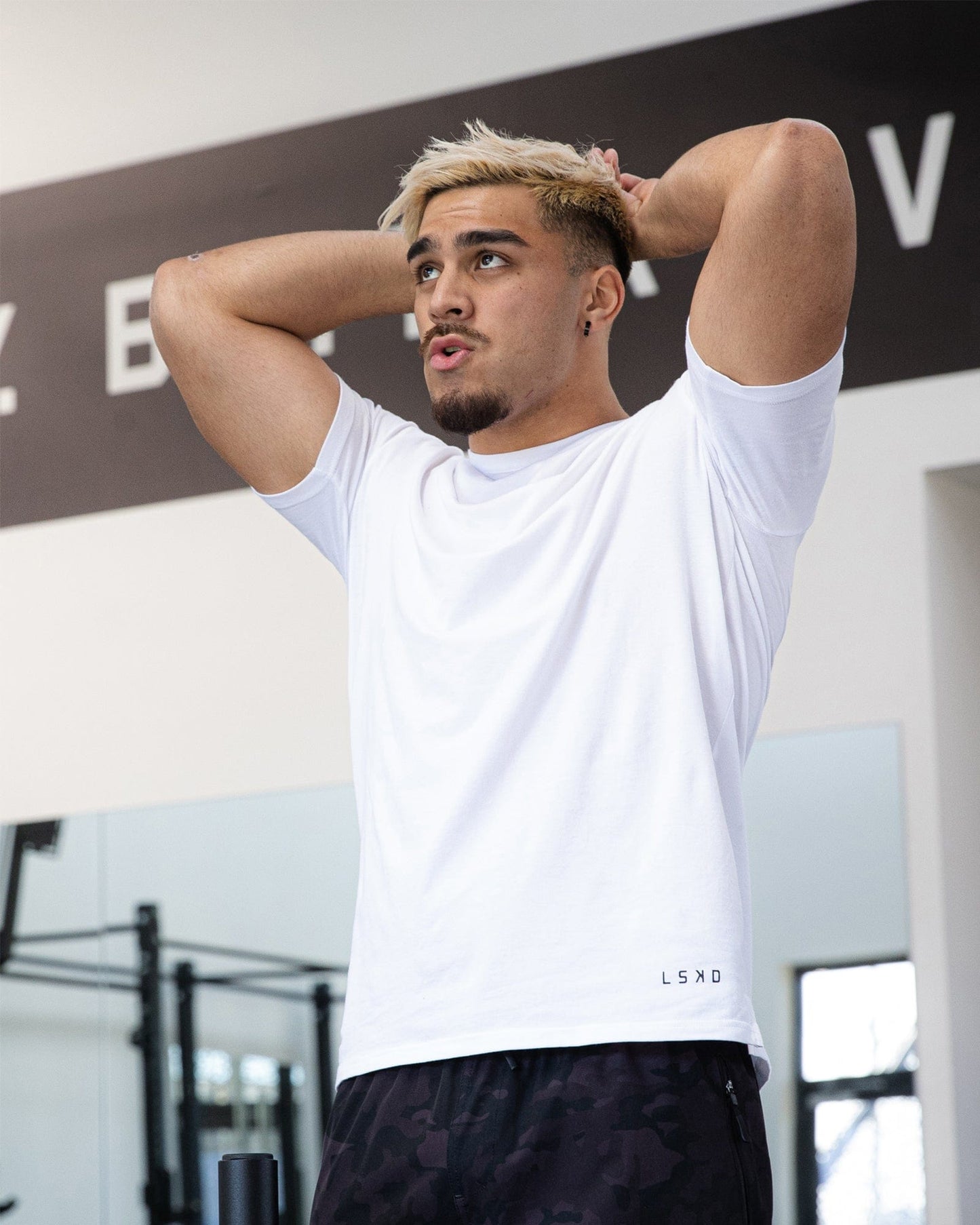 Model wearing Intensity FLXDRY Performance Tee - White