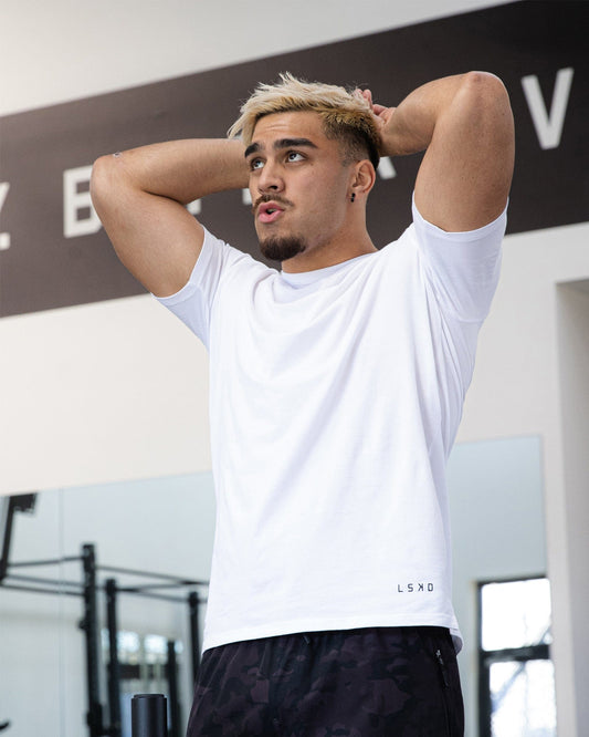 Model wearing Intensity FLXDRY Performance Tee - White