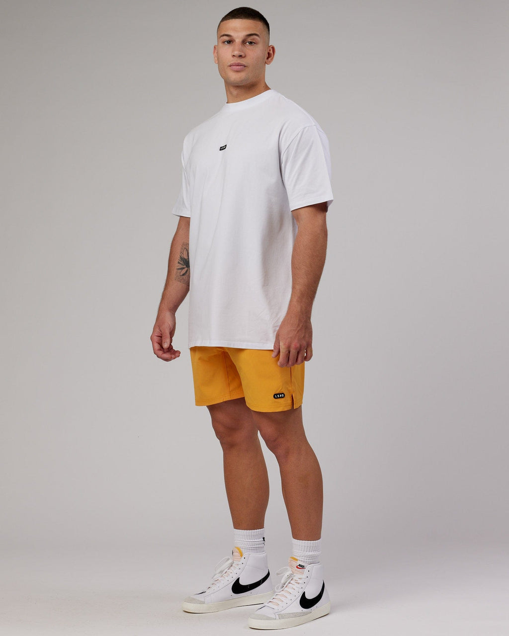 Model wearing Capsule 7" Performance Short - Butterscotch