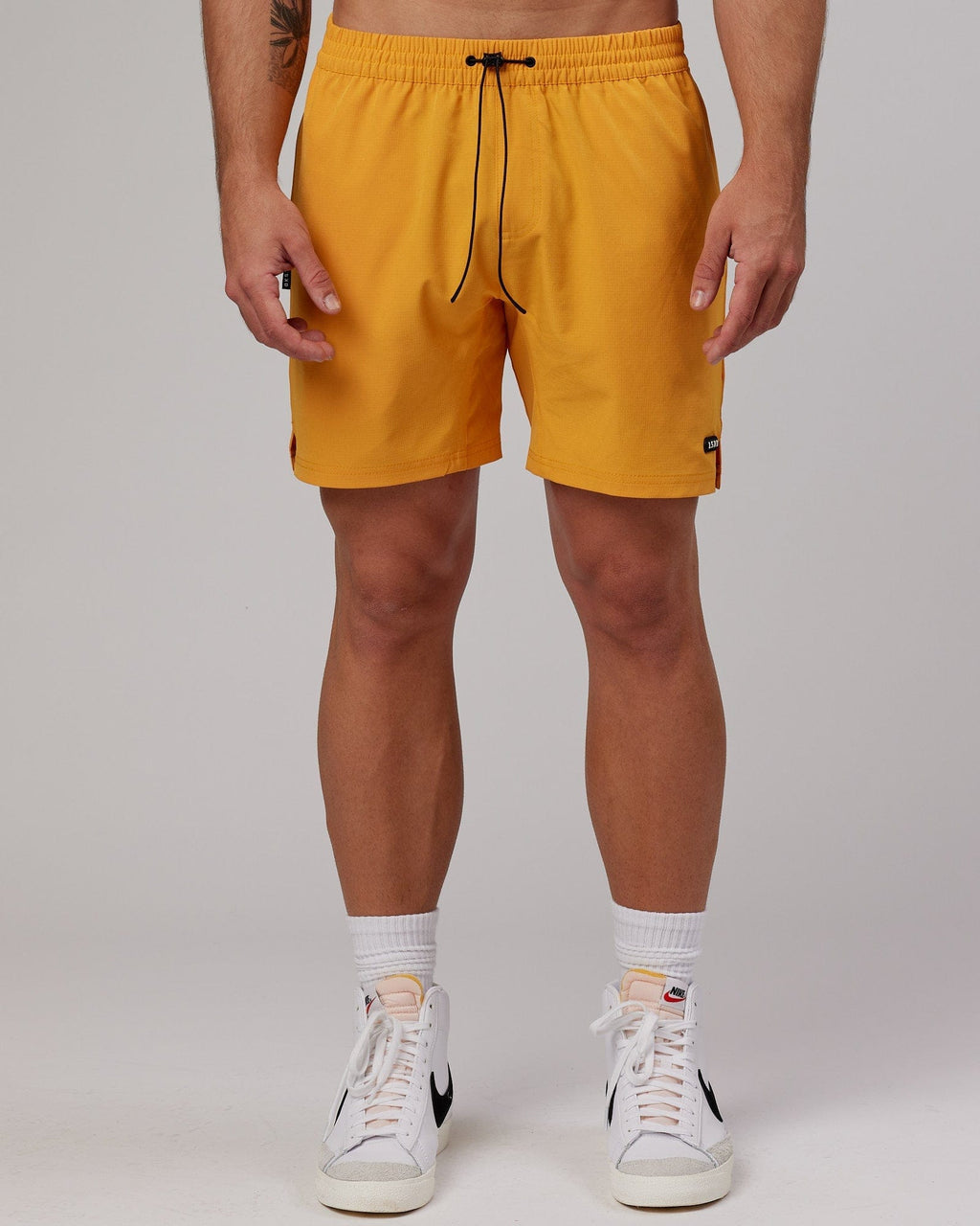 Model wearing Capsule 7" Performance Short - Butterscotch