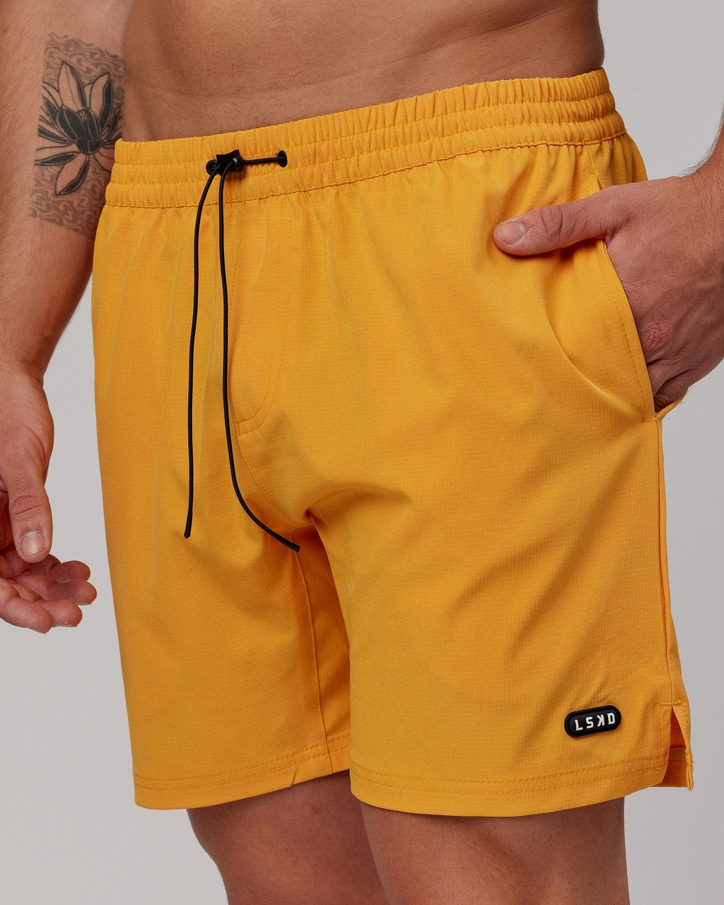 Model wearing Capsule 7" Performance Short - Butterscotch