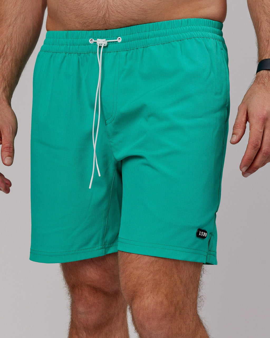 Model wearing Capsule 7" Performance Short - Hyper Teal
