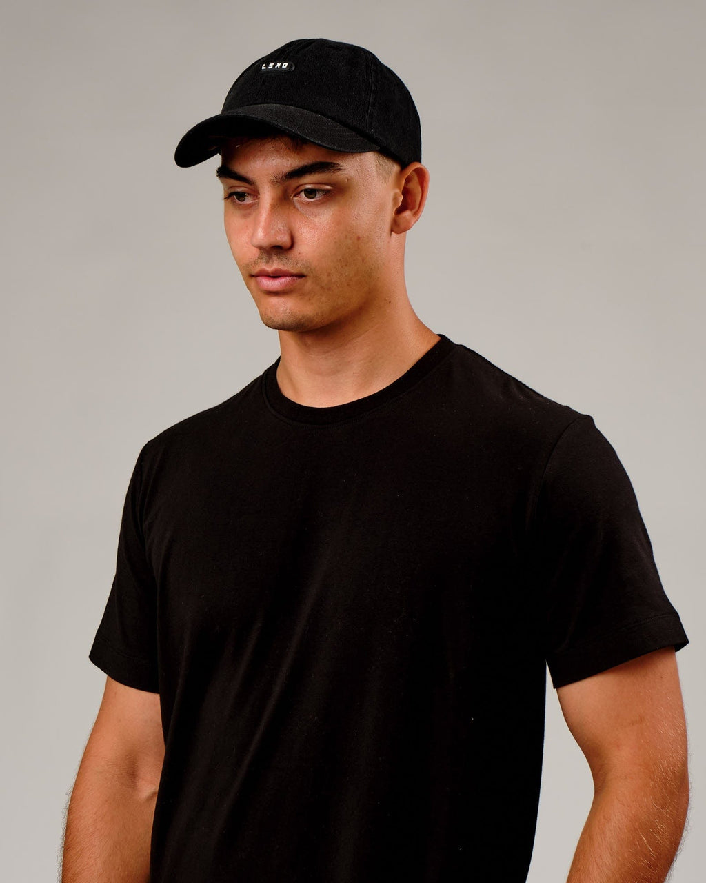 Model wearing Capsule Cap - Black