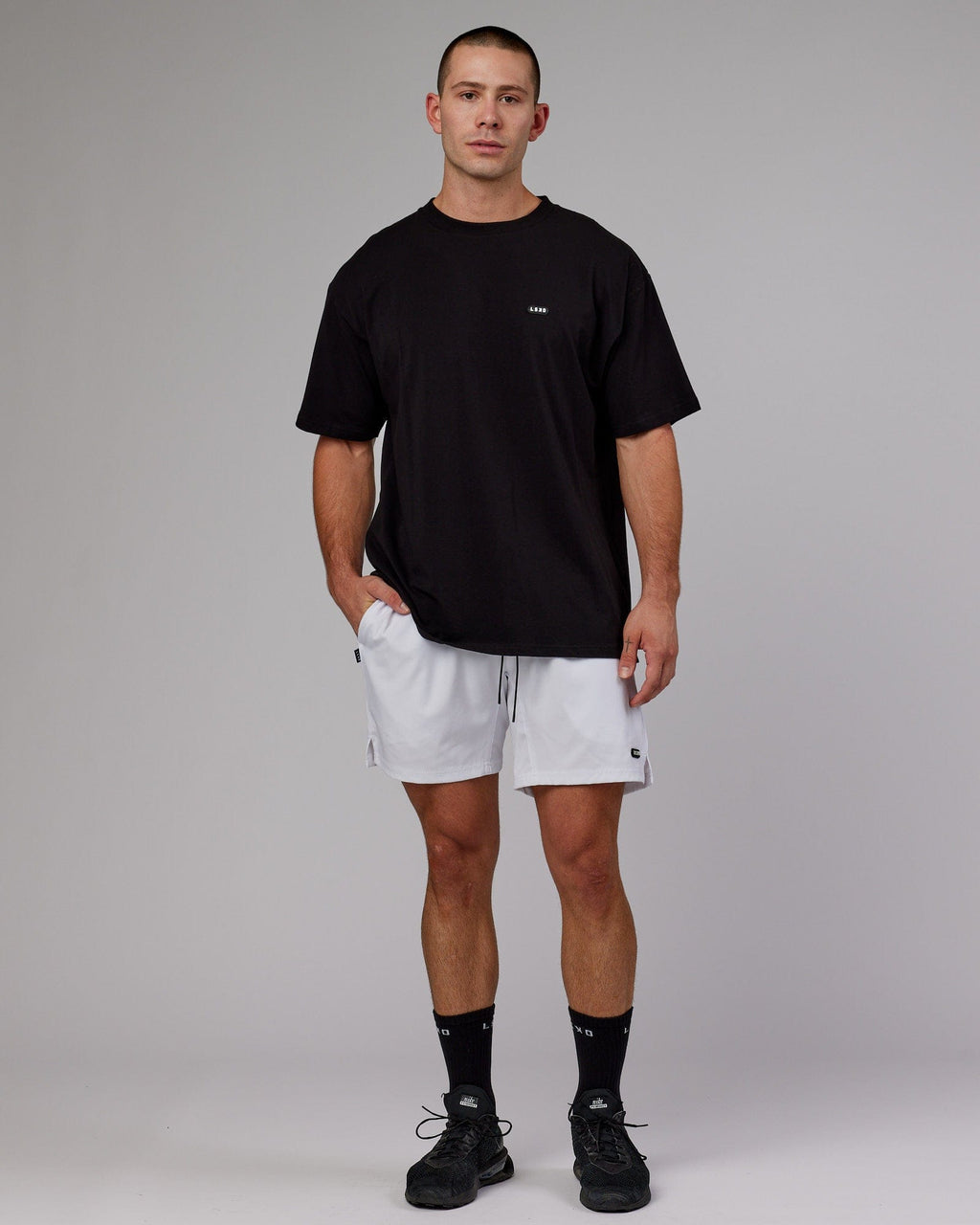 Model wearing Capsule 7" Performance Short - White