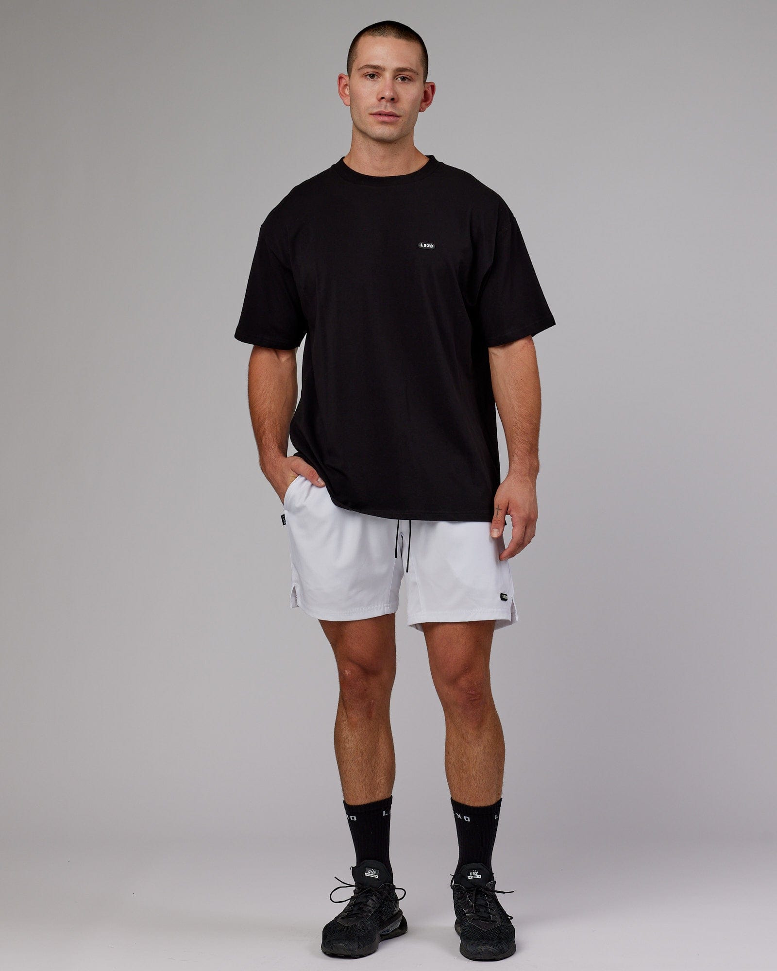 Model wearing Capsule 7" Performance Short - White