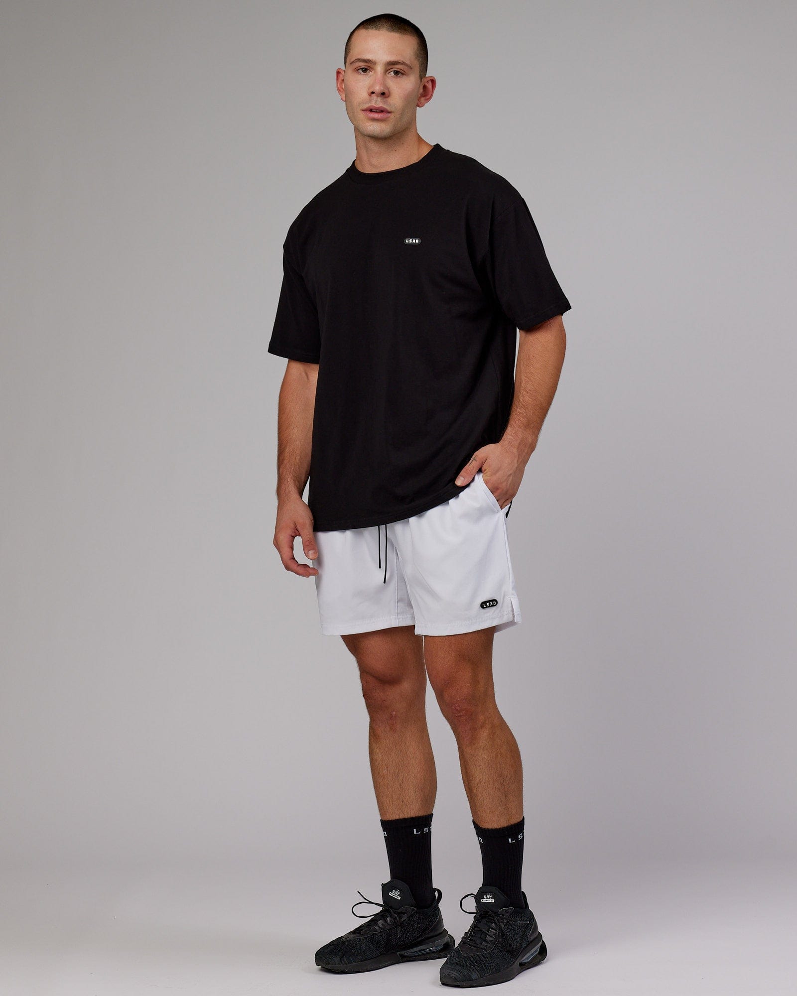 Model wearing Capsule 7" Performance Short - White