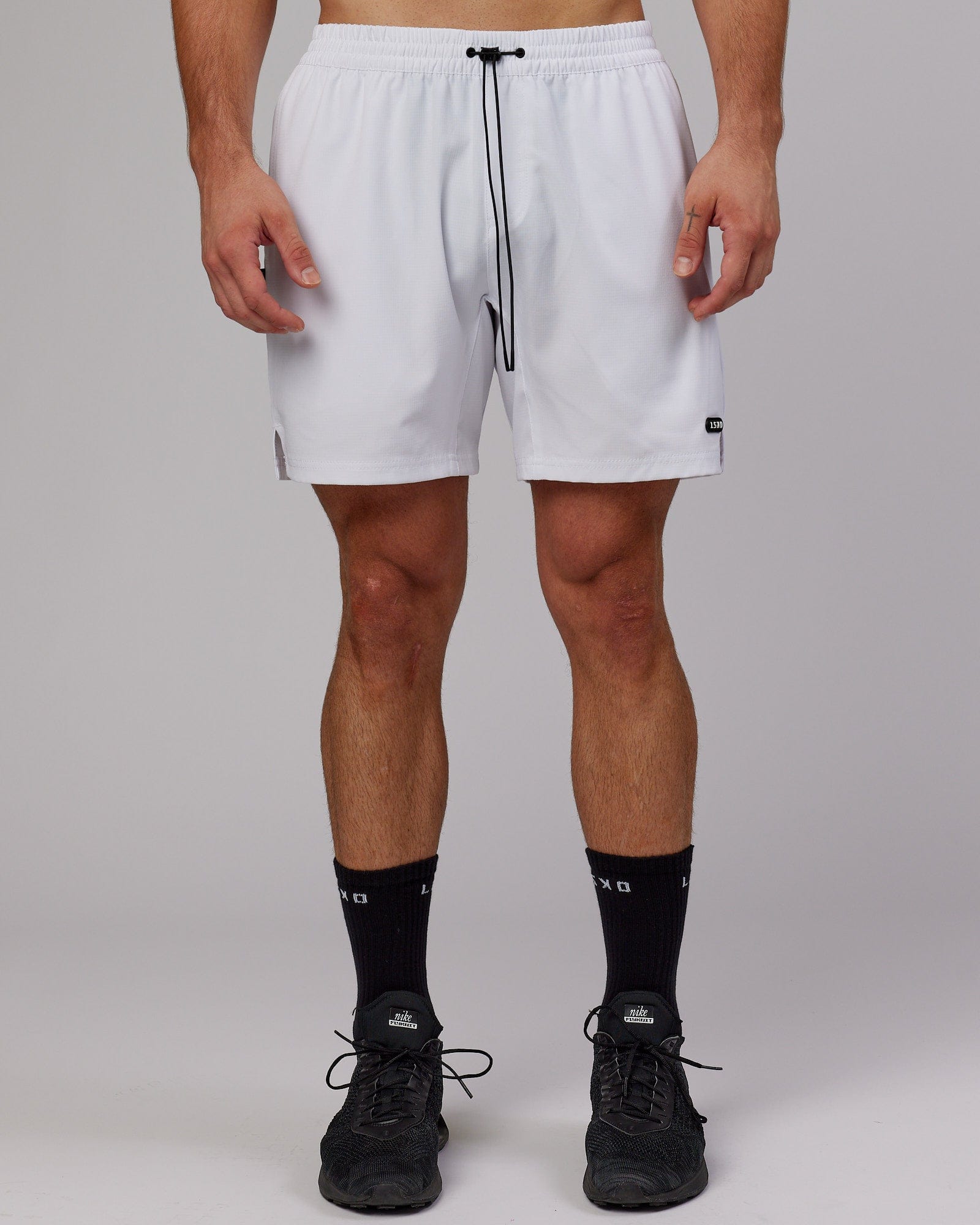 Model wearing Capsule 7" Performance Short - White